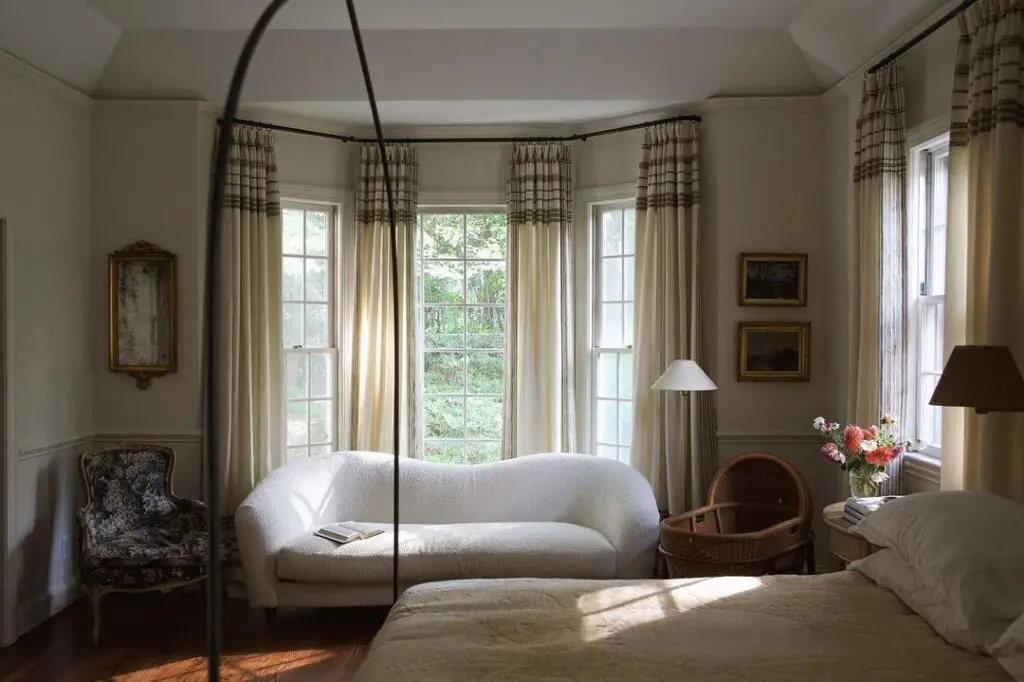 Sunny bedroom with window seat and sofa
