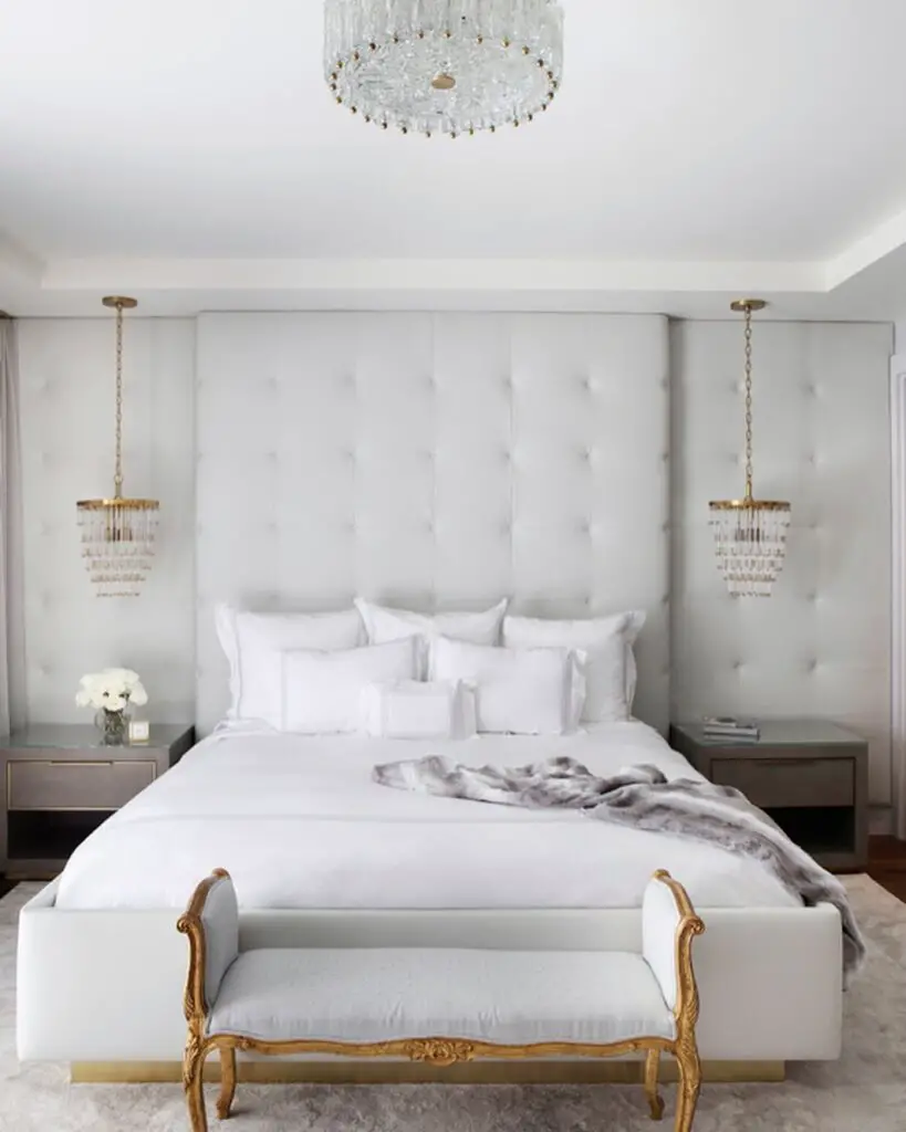 Luxurious white bedroom with crystal chandeliers