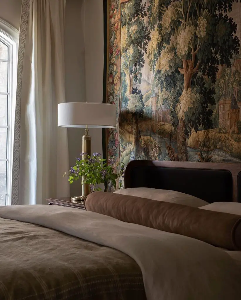 Bedroom with forest tapestry and lamp