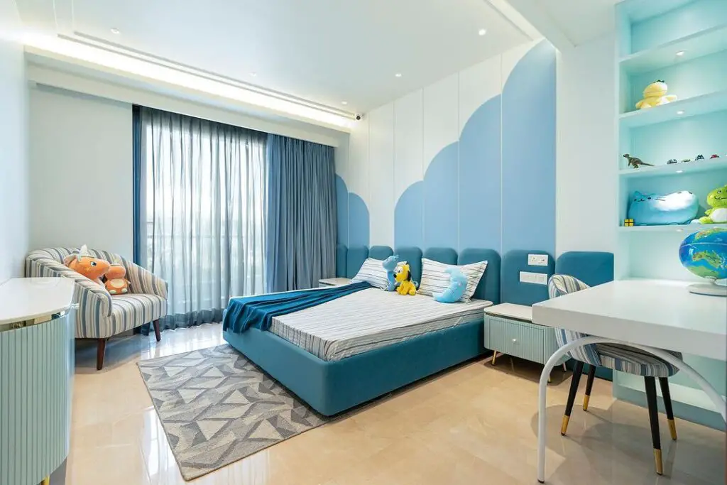 Blue cloud-themed kids bedroom with toys