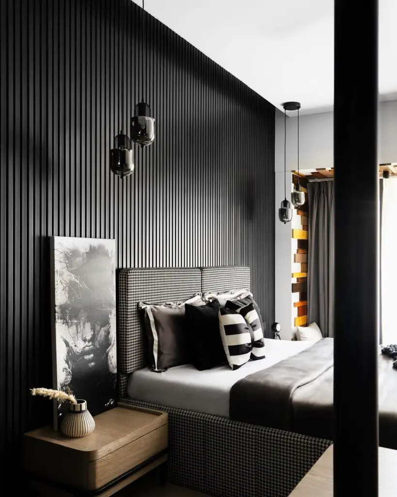 Sleek bedroom with black slat wall