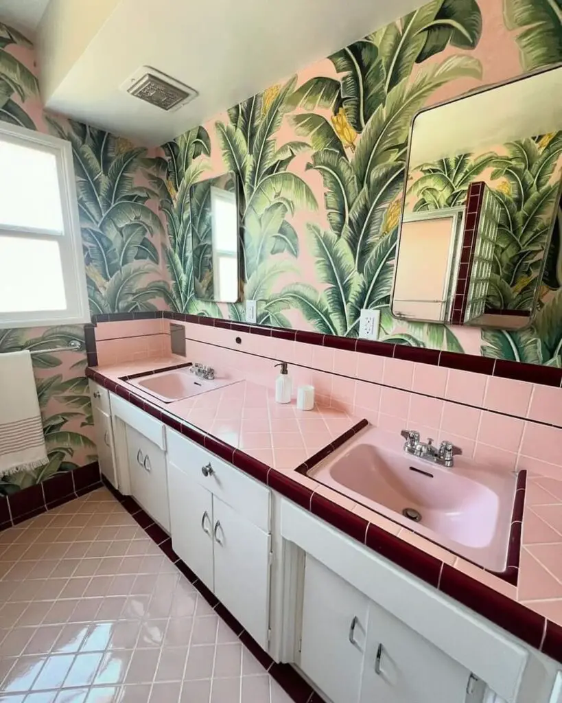 Pink retro bathroom with green leaf wallpaper