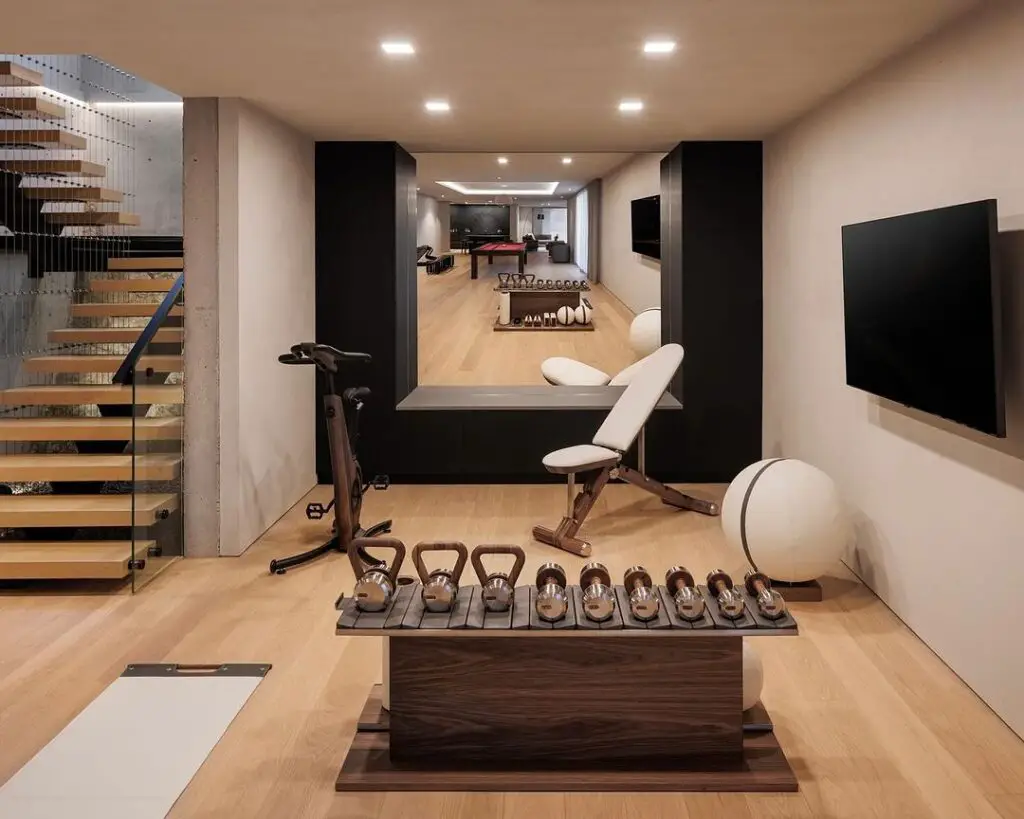 Stylish basement gym with diverse equipment and modern design