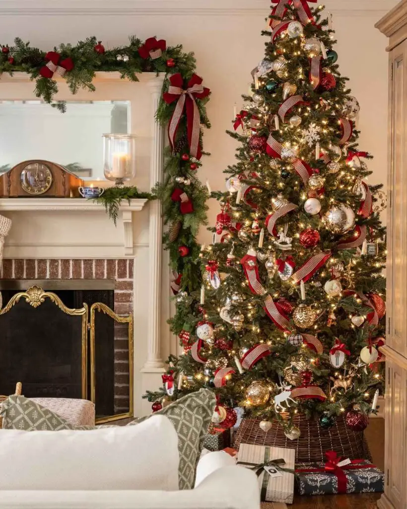 Elegant living room with lavishly decorated Christmas tree, garland-adorned fireplace, and wrapped presents