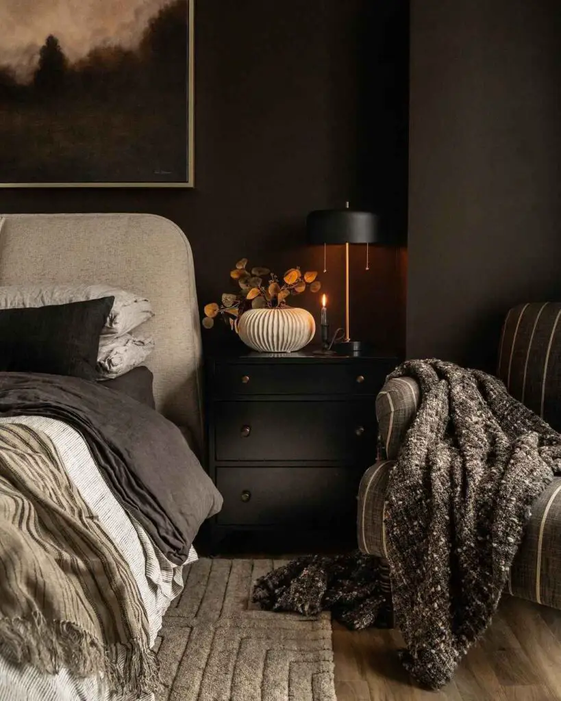 Dark cozy bedroom with autumn decor and soft lighting
