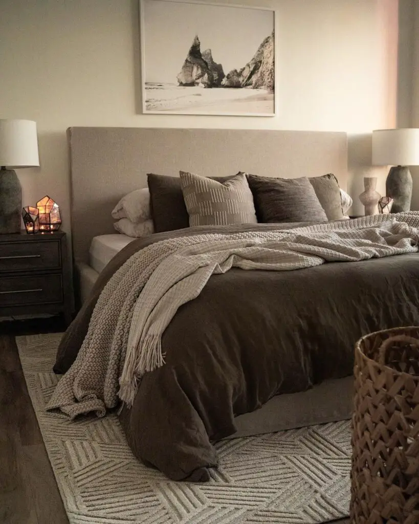 Dark cozy bedroom with beach picture above bed