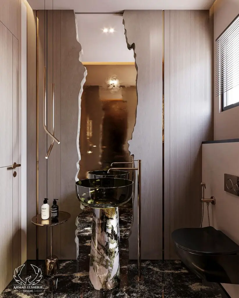 Modern bathroom with artistic sink and metallic accent wall