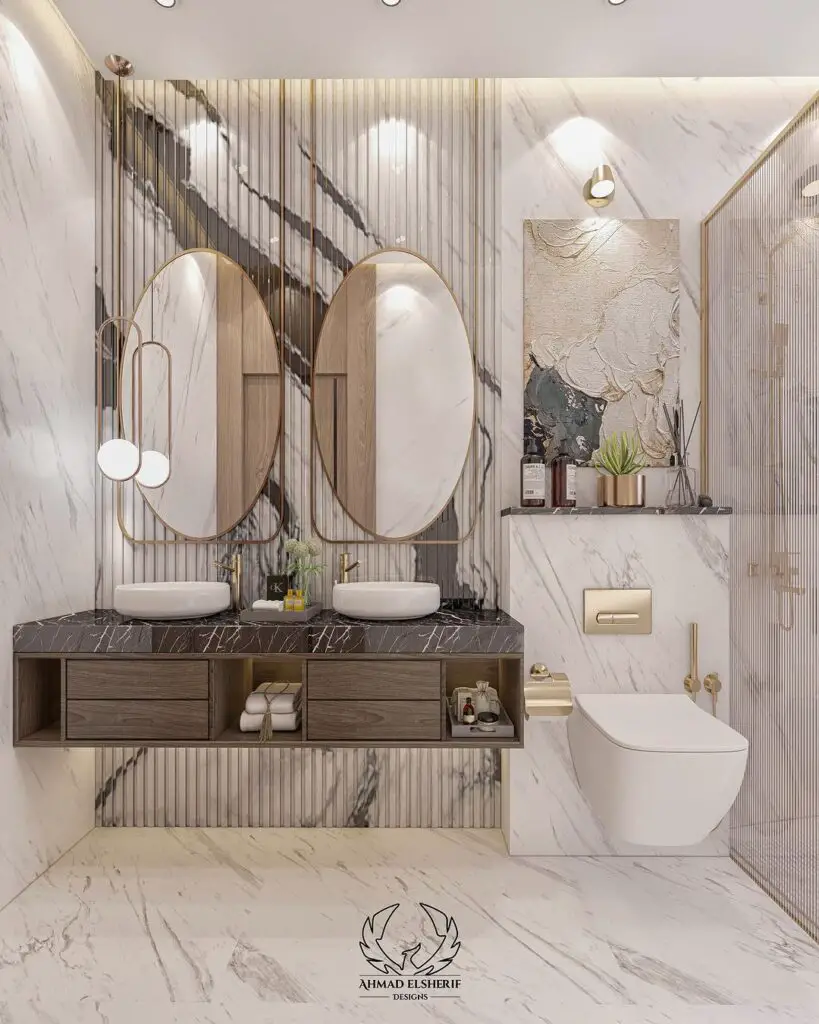 Luxurious marble bathroom with dual vanity and gold accents