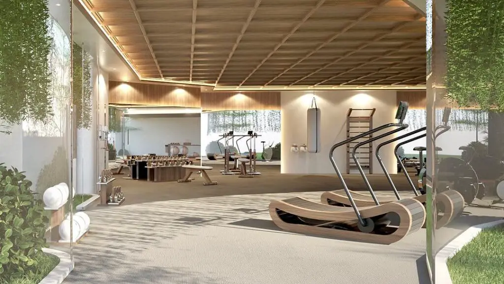 Luxurious open-air home gym with wooden equipment and plants