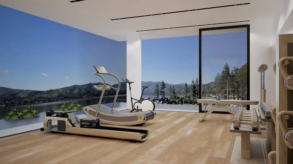 Home gym with panoramic mountain lake view and modern equipment
