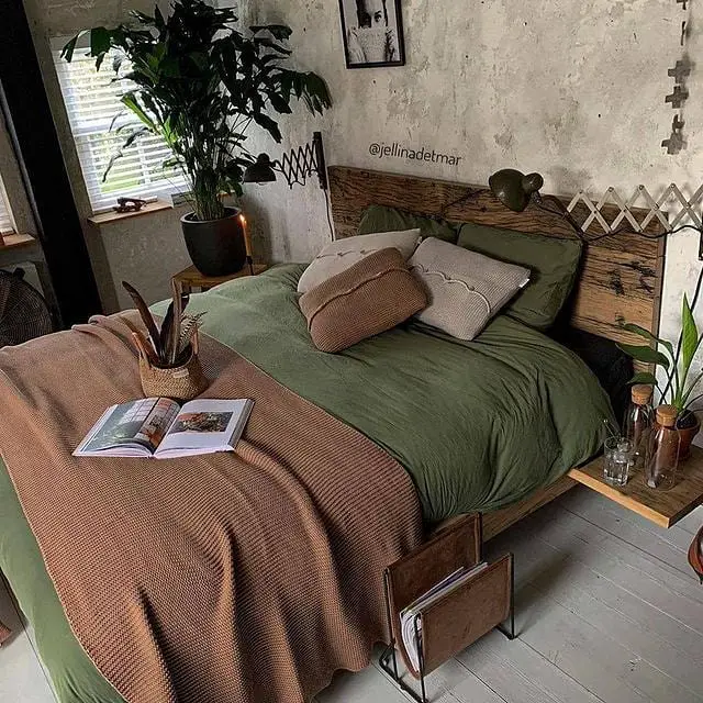 Cozy bedroom with green bedding and potted plants