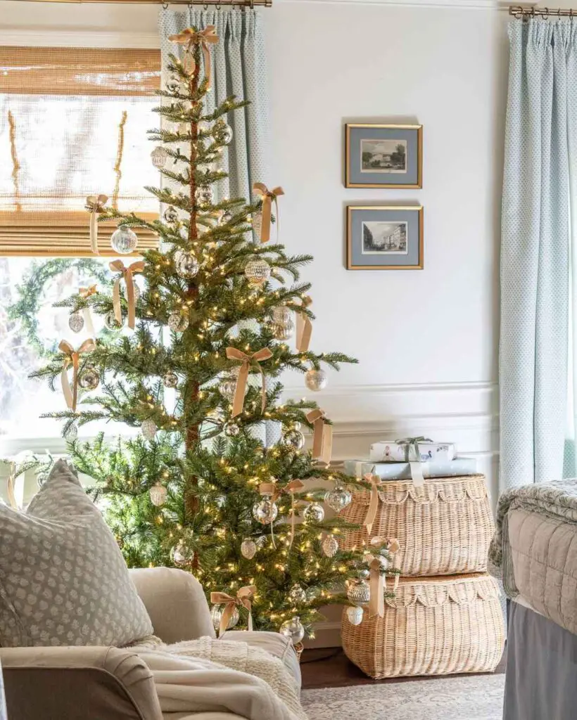 Coastal-themed living room with elegant Christmas tree, woven baskets, and soft furnishings