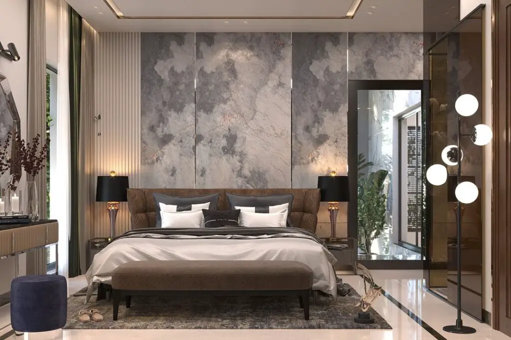 Modern bedroom featuring marble-effect wall and mixed textures