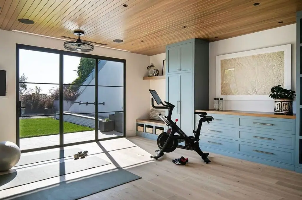 Bright home gym with exercise bike and outdoor view