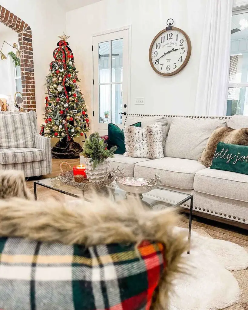 Festive living room with decorated tree and cozy sofa