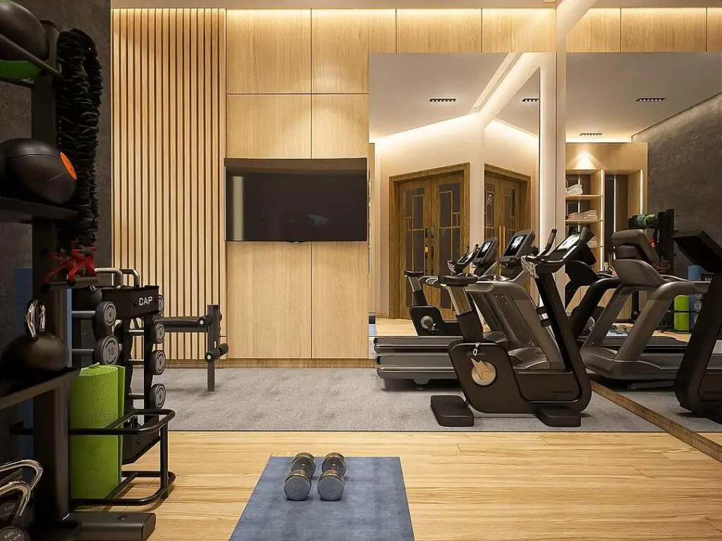 Stylish home gym with wood paneling and modern equipment