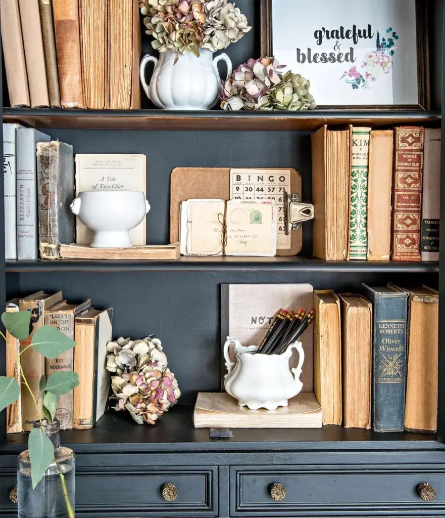 Rustic bookshelf with autumn-inspired literary decor.