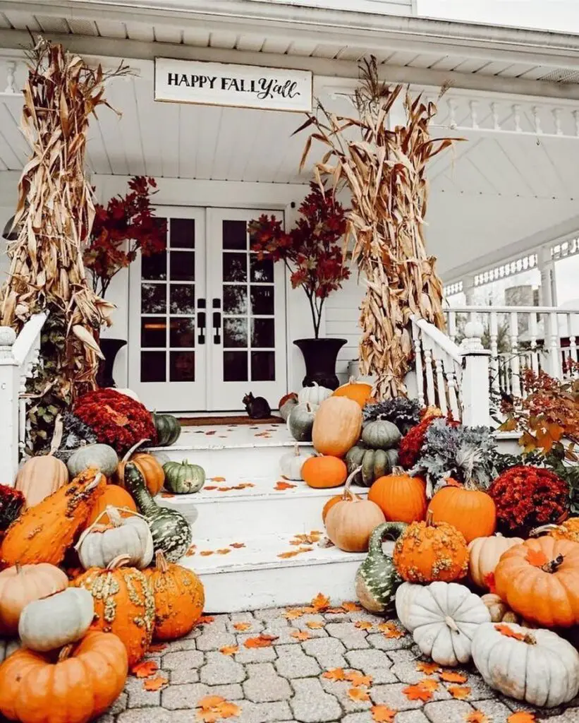 Pumpkin-laden porch with corn stalk archway