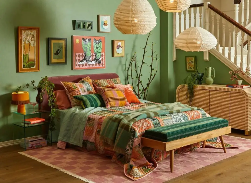 Colorful bohemian bedroom with green walls eclectic decor and patchwork bedding