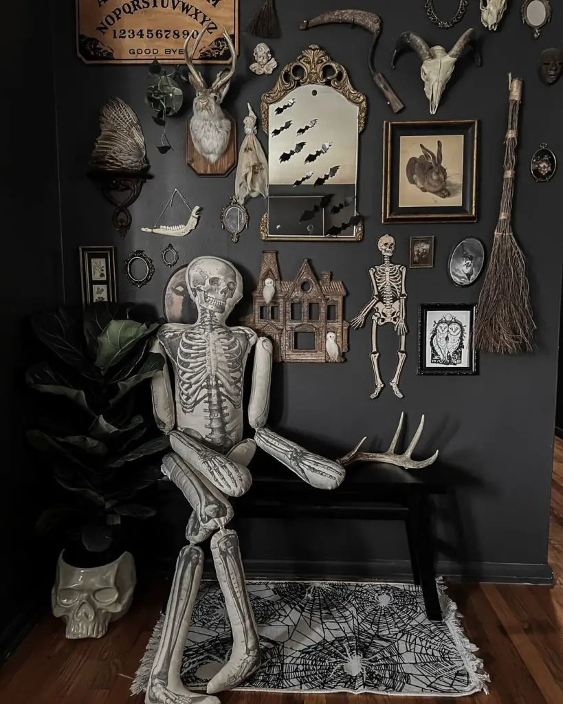 Gothic decor with skeleton and wall of spooky artifacts