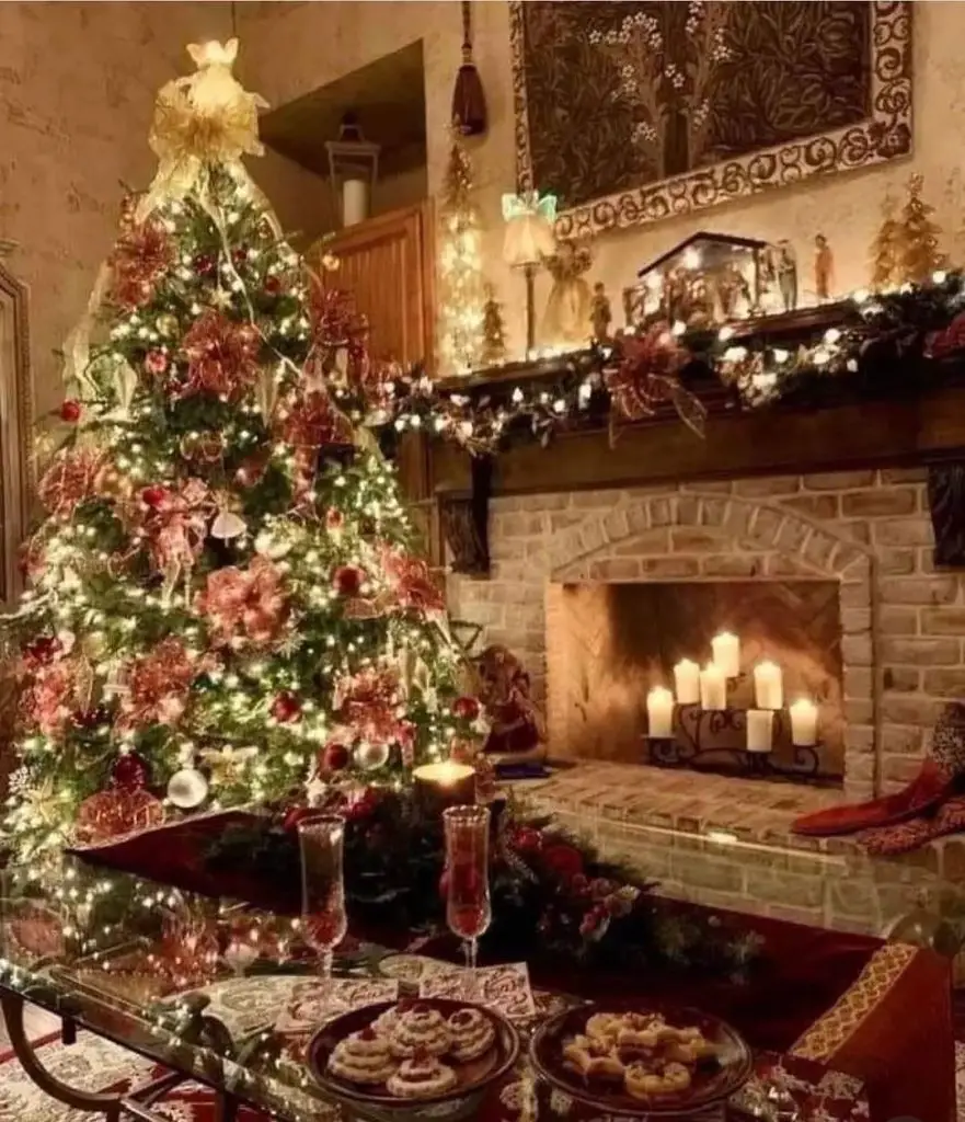 Decorated Christmas tree next to fireplace with festive table setting