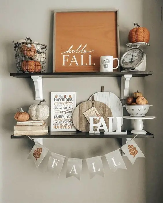 Fall-themed shelves with pumpkins signs and rustic decor
