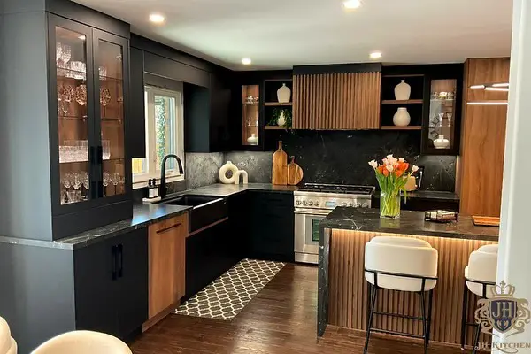Modern kitchen with black cabinets and wood accents