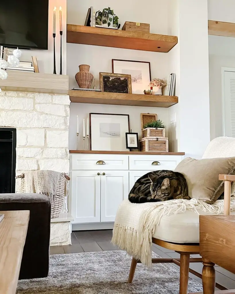 Living room with floating shelves fireplace and sleeping cat