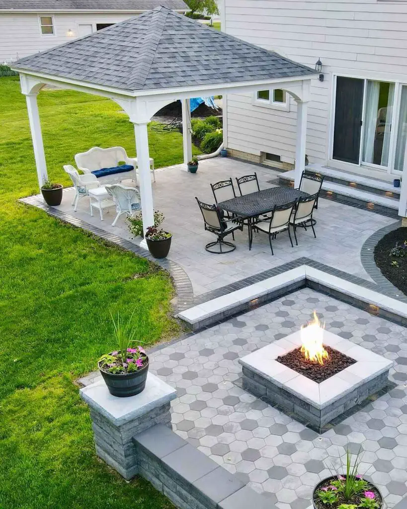 Backyard with white gazebo patio and sunken fire pit area