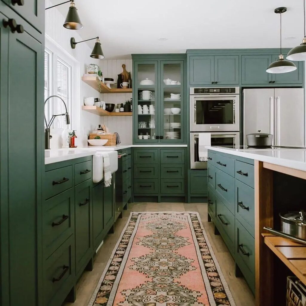 Green kitchen with vintage pink runner and open shelving
