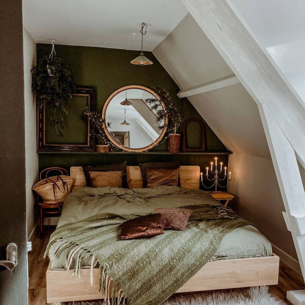Cozy attic bedroom with green walls and rustic decor