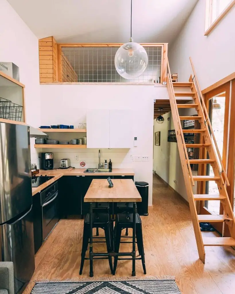 Compact kitchen with loft and wooden ladder