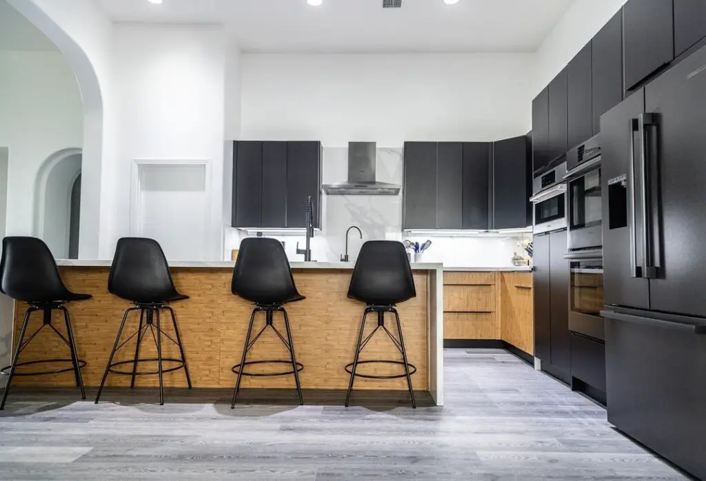 Black cabinets wood island modern kitchen