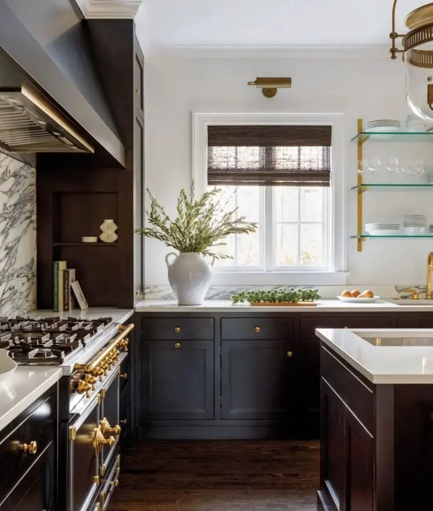 Elegant black kitchen with gold hardware and white accents