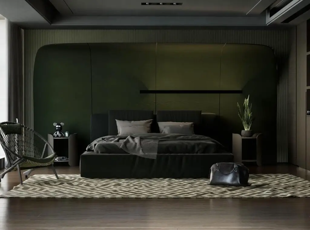 Dark green bedroom with black bed geometric rug and curved wall alcove