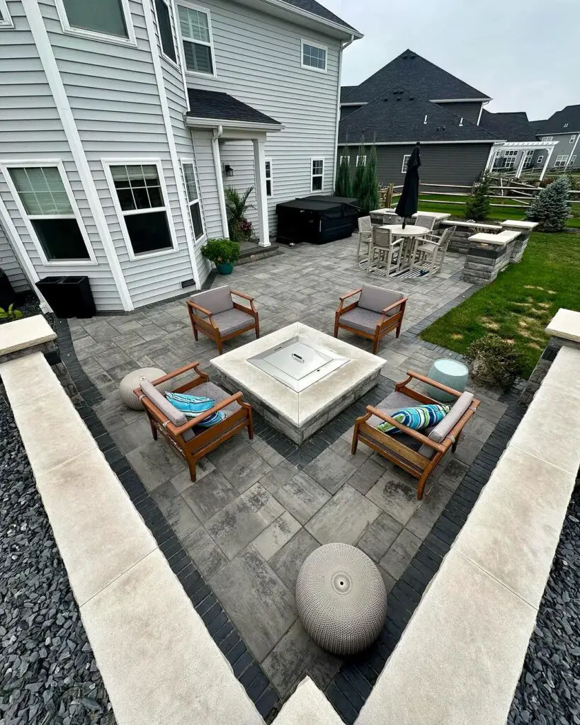 Modern patio with fire pit lounge chairs and dining area
