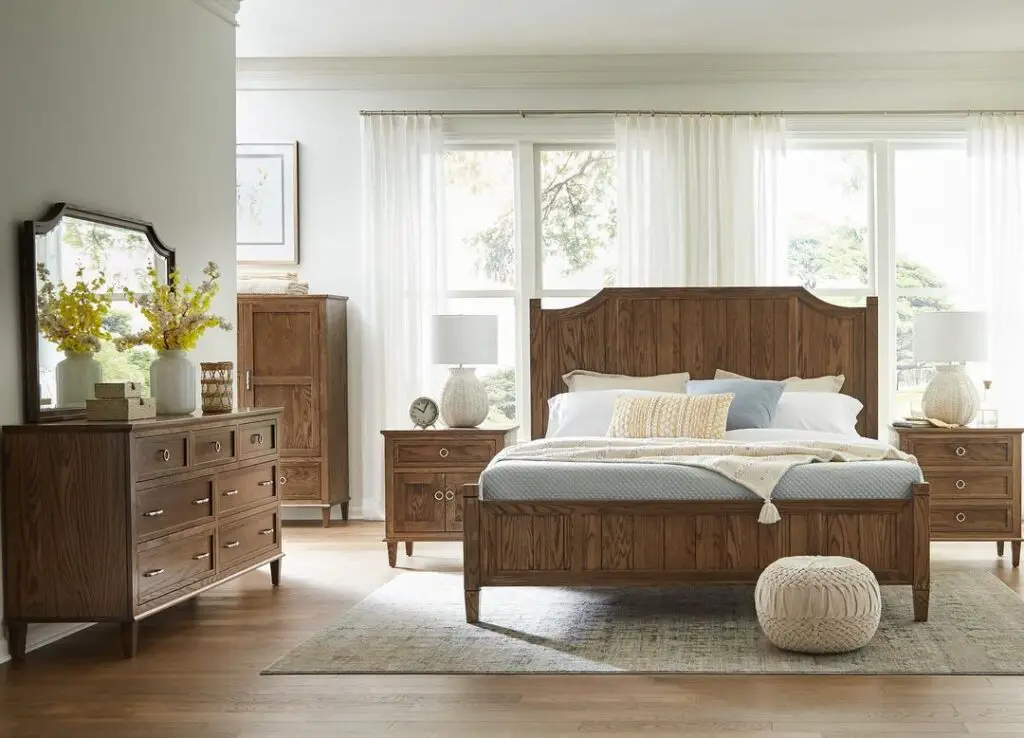 Sunlit bedroom with wooden furniture set
