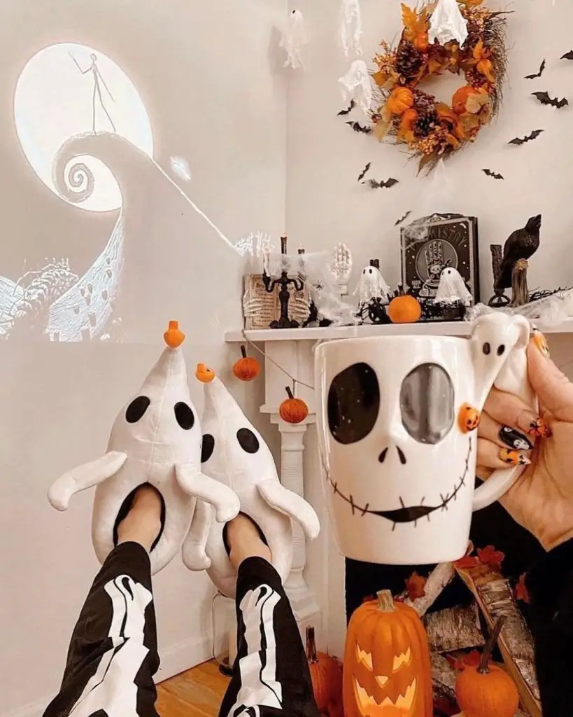 Halloween decor with ghost slippers Jack Skellington mug and festive decorations