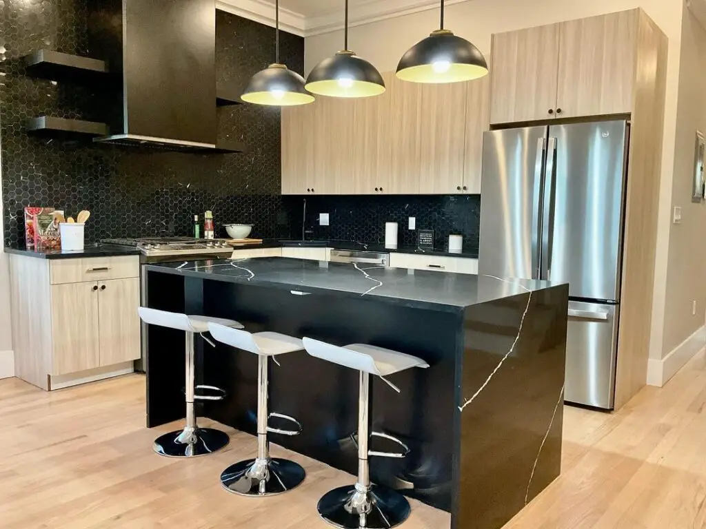 Modern kitchen with black island light wood cabinets