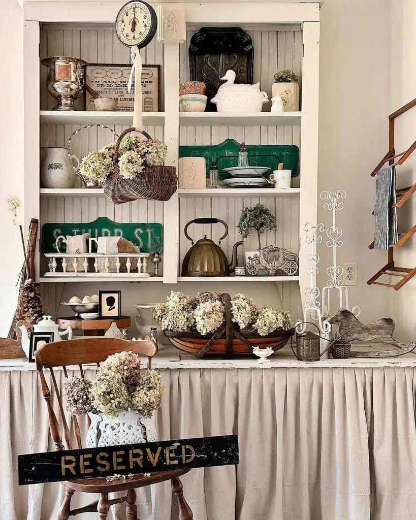 Vintage farmhouse hutch filled with antiques and decor
