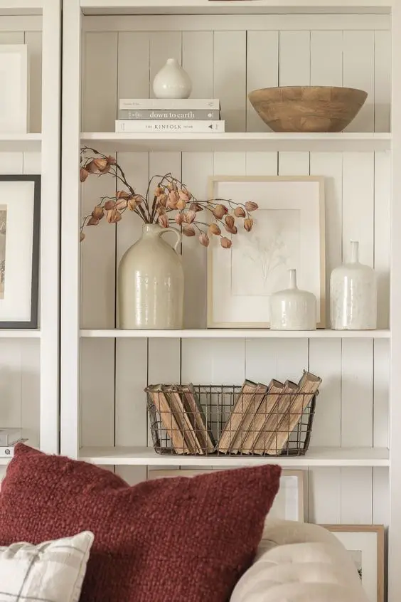 Neutral styled shelves with ceramics and dried flowers