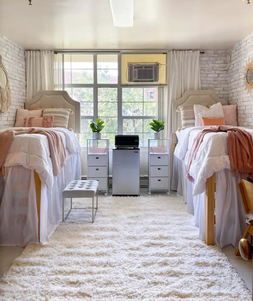 Symmetrical dorm room with twin beds and large windows