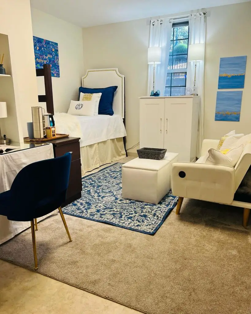 Stylish dorm room with navy blue accents and modern furniture