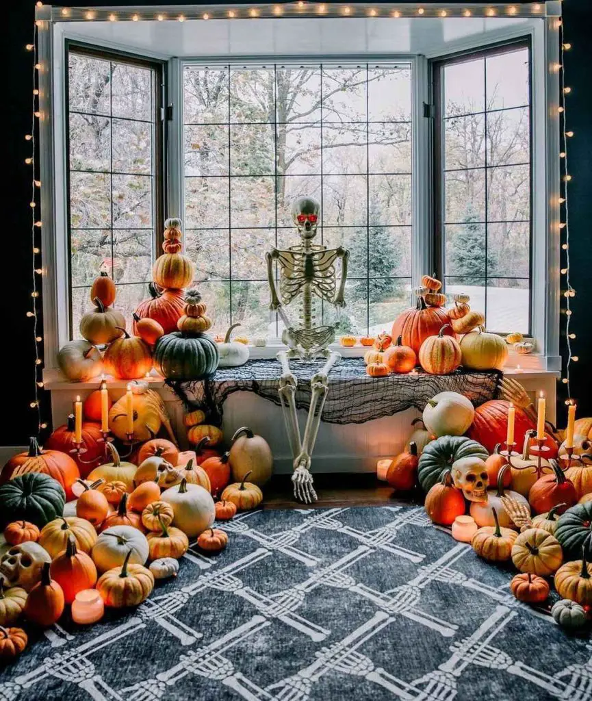 Skeleton lounges in pumpkin-filled Halloween window