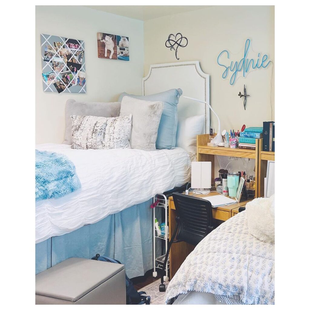 Dorm room with blue accents personalized decor and study area
