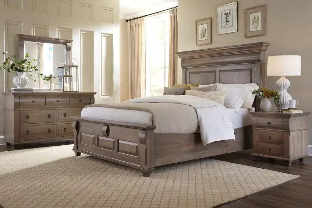 Elegant bedroom with large wooden bed and dresser