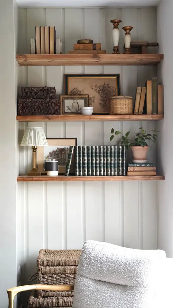 Wooden shelves with books artworks and decor