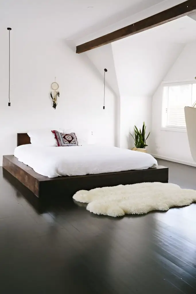 Modern bedroom with white bed and glass pendant light