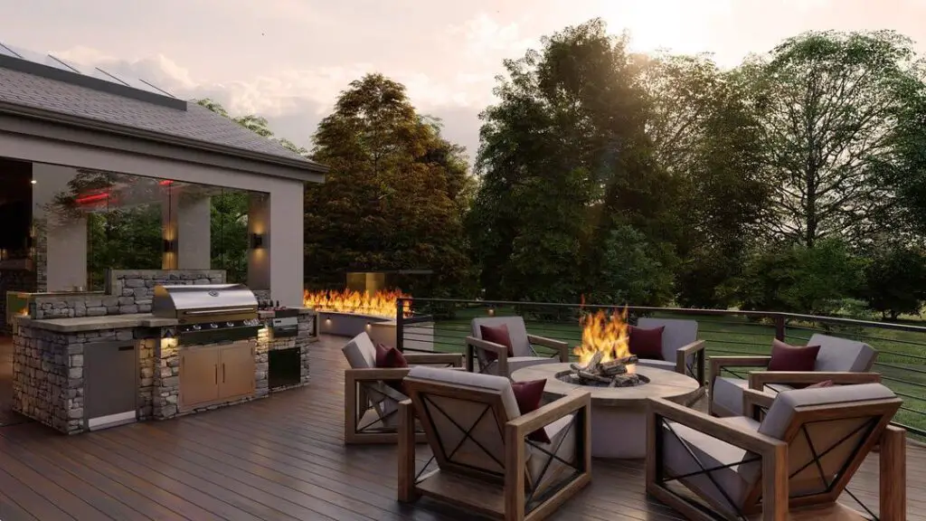 Deck with fire pit outdoor kitchen and sunset view