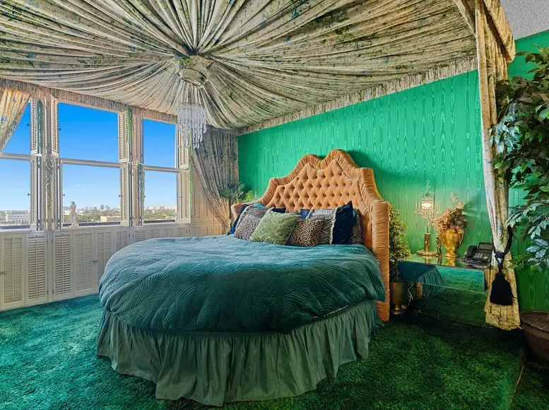 Luxurious green bedroom with draped ceiling